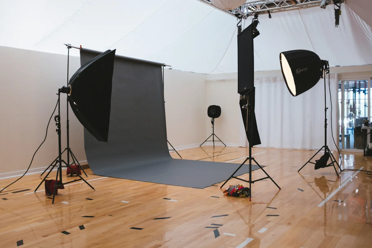 Active film production set with crew lighting and camera equipment at a North Texas sound stage