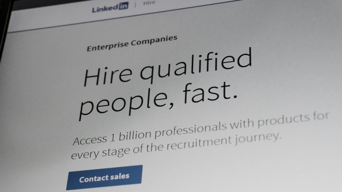 LinkedIn Hire landing page on a laptop screen, one of the jobs hiring website options compared by Frontline Source Group recruiters