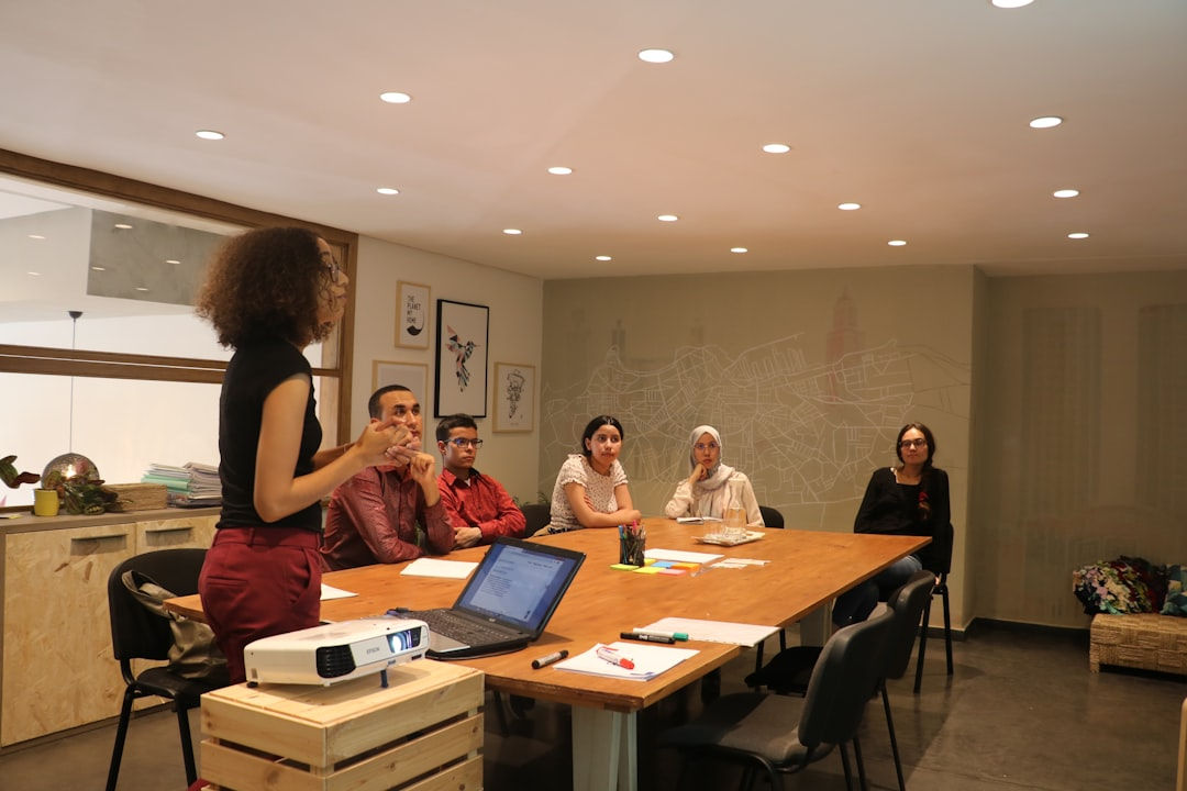 Senior HR recruiter at Frontline Source Group meeting with corporate HR leadership team to plan a CHRO executive search