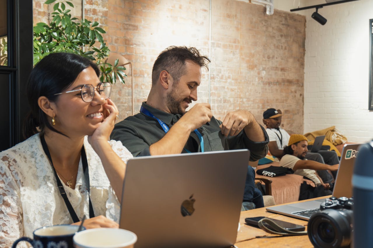 Two professionals collaborating in an office during a job search and career planning session